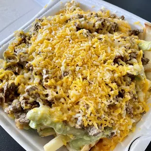 Carne asada fries with soggy fries and flavorless carne asada. (Soupy salsa verde not pictured)