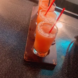 three glasses of orange juice