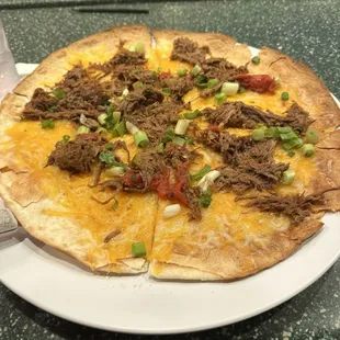 Cheese crisp with shredded beef and green onions