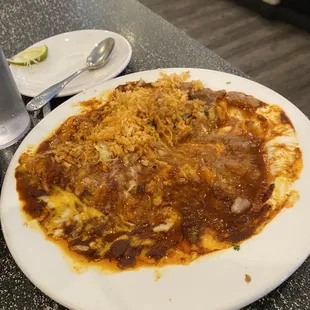 Chicken enchilada floating in oil