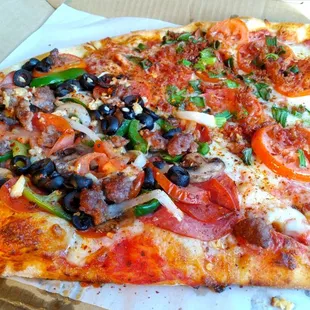 Two slices (from left to right): one slice of Serrano&apos;s, one slice of Americana; $25 after taxes.