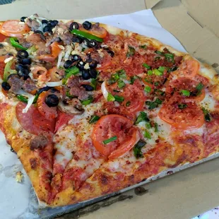 Two slices (from left to right): One slice of Serrano&apos;s, One slice of Americana; $25 after taxes.