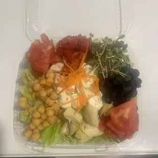 a salad in a plastic container