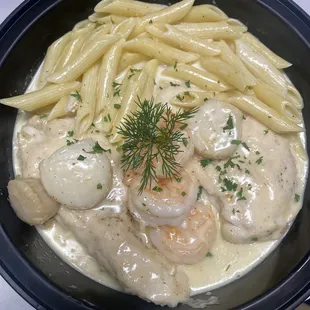 a bowl of pasta and shrimp