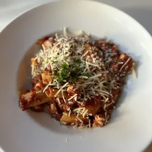 a plate of pasta with parmesan cheese