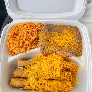 Rolled taquitos with rice and beans. Add red sauce for an even better bite.
