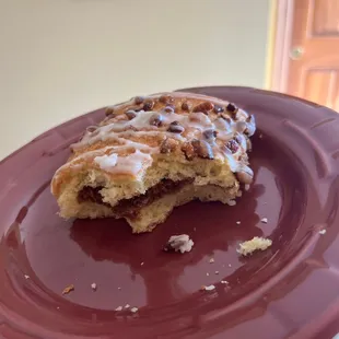 a half eaten pastry on a plate