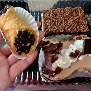 a hand holding a pastry