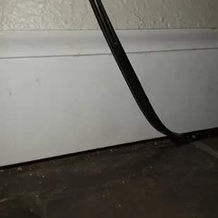 A baseboard replaced, with an electrical plug left behind the baseboard...‍