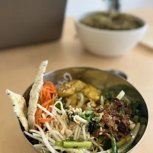 SIDE TOP angle view of Salad Noodle bowl (Bún) with Turmeric fish