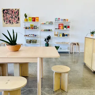 a table and stools in a room
