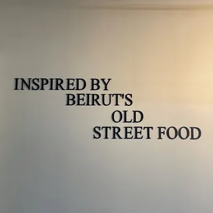a sign that reads inspired by beirut&apos;s old street food