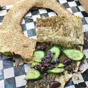 Kaak with zatar seasoning olives and cucumber. Very tasty.
