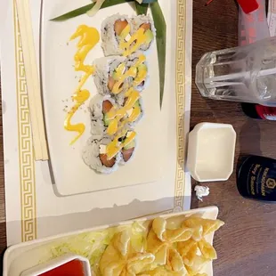 a plate of sushi and chips