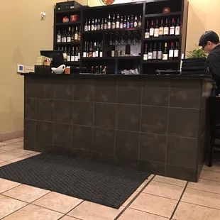 Bar behind payment counter