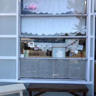 Storefront. A couple of outdoor benches.