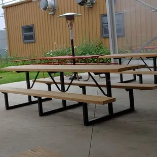 a group of people sitting at picnic tables