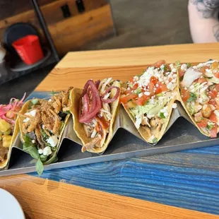 Carnitas taco, portobello taco, bbq chicken taco, grilled fish tacos
