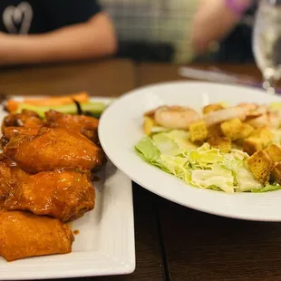 Chicken wings and Caesar salad