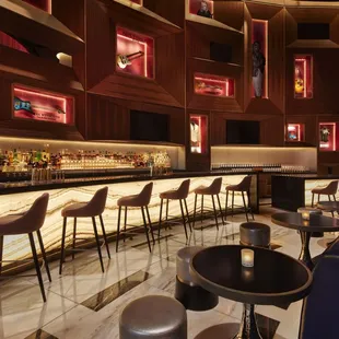 a bar with stools and tables