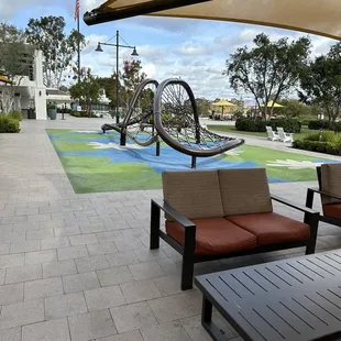 Outdoor play area lots of shaded seating, right outside the restaurant