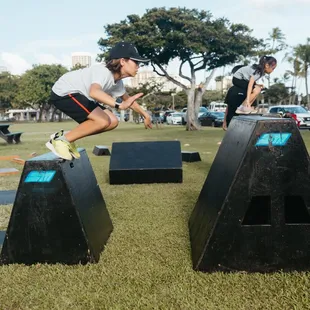 Jumping across boxes to avoid touching the ground.