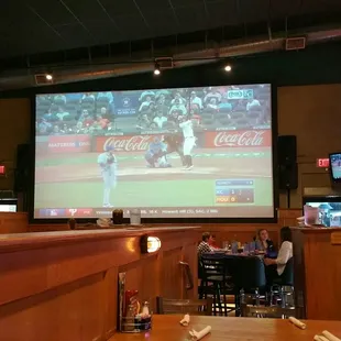 a baseball game on a big screen