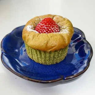 Green tea chiffon cake filled with azuki beans and topped with strawberry