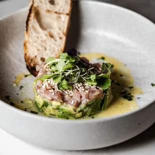 a bowl of food with bread