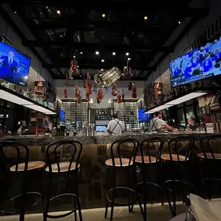 The bar covers half of the indoor space and can seat 14 on three sides. Check out the musical instruments hanging overhead!