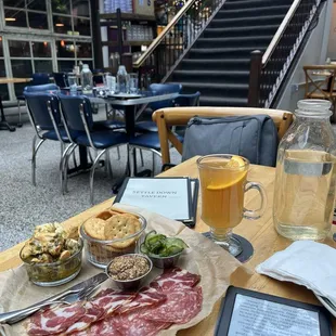Atrium, hot toddy, meat and cheese plate