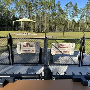 Dog park divided by big dogs (over 30 pounds) and small dogs (under 30 pounds).