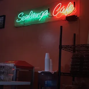 a neon sign in a coffee shop