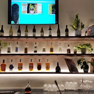 a tv mounted above a bar