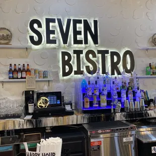 a bar with a neon sign