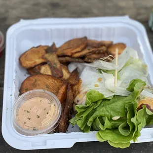 Lettuce wrapped bacon cheeseburger. With fries