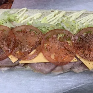 a sandwich with tomatoes and cheese