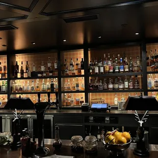 a bar with a lot of bottles