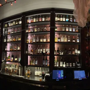 a large display of liquor bottles