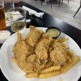 Chicken strips and French fries with homemade honey mustard