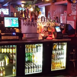 a bar with several bottles of beer