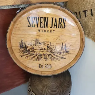 a wooden barrel with a wine label on it