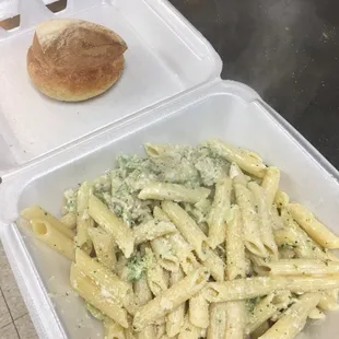 Chicken and broccoli alfredo pasta , served with homemade bread !