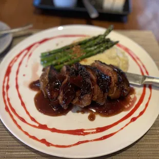 cherry duck, garlic whipped mashed Potatoes, and asparagus