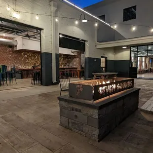 a fire pit and tables