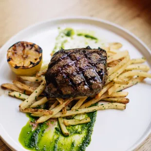 a steak and fries on a plate