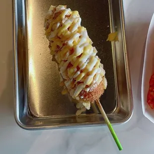 Potato sausage rice corndog。Topped with sweet mustard and ranch! Delicious!