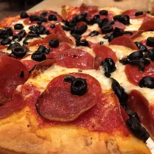 Medium pizza with pepperoni and olives