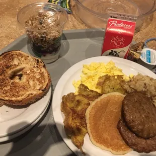 Bagel.  Yogurt.    To the right is a junior combo - egg, pancake, sausage, frech toast $6.50 (separate from above)