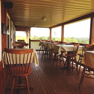 a patio with tables and chairs